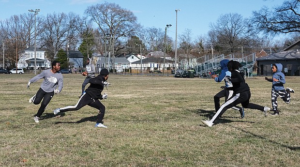 A group of John Marshall High School football players take advantage of a cold Sunday afternoon the week before Super Bowl LVI to play a game at Hotchkiss Field Community Center in North Side. No final score was provided, but the free game was cheaper entertainment than this weekend’s big event at SoFi Stadium outside Los Angeles.