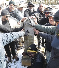 Members of the Virginia Association of Chapters of Alpha Phi Alpha Fraternity gather recently at Evergreen Cemetery at the family gravesite of Joseph Endom Jones and Rosa Kinckle Jones, parents of one of Alpha Phi Alpha Fraternity’s seven founders, Eugene Kinckle Jones. The Jones family, which had long associations with schools that became part of Virginia Union University, lived in Richmond in the late 1880s and early 1900s.