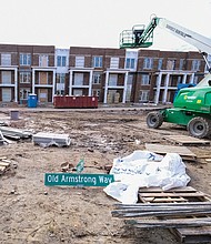 Armstrong Renaissance is heading to the finish line after more than three years of construc- tion at this East End site near the city’s border with Henrico County. Crews now are focusing on development of the final phase – 36 attached and detached homes to be sold at market rates – that will cap the redevelopment on the former site of Armstrong High School. 
Oversized compared with most of the homes on nearby streets, the new houses were initially priced between $225,000 and $350,000 and are designed to add a residential cachet to the area.
When finished, the total 22-acre development will contain 256 modern apartments and houses. The first residents moved in just before Thanksgiving in 2019.
Previously called Church Hill North, Armstrong Renaissance is the creation of a partnership of the Richmond Redevelopment and Housing Authority and the Boston-based nonprofit affordable housing developer, The Community Builders. The project is designed as the first step in the future redevelopment of the 30-acre Creighton Court public housing community located across Nine Mile Road.
The new units were used, in part, to relocate Creighton Court residents, clearing the way for a large chunk of the public housing community to be bulldozed and replaced with new units. Demolition of a major portion of Creighton Court is expected this year.
Mayor Levar M. Stoney and Richmond City Council cleared the way by allocating $6.8 million in federal American Rescue Plan Act funds to pay for new streets, alleys and underground utilities in the Creighton Court redevelopment.