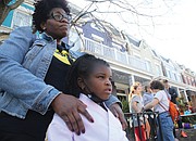 Tamara Ross and her daughter, Kori, 6, a kindergartener at Fox, view the damage to the school Saturday.