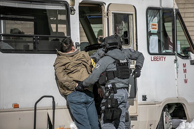 Canadian authorities carried out a massive operation at Ottawa's city center for protesters and trucks Friday.
Mandatory Credit:	Amru Salahuddien/Anadolu Agency/Getty Images