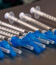 A fourth Covid-19 shot might be recommended this fall, as officials 'continually' look at emerging data. Pictures are Covid-19 vaccine syringes at a vaccination clinic in Peabody, Massachusetts, on January 26.
Mandatory Credit: Bloomberg via Getty Images