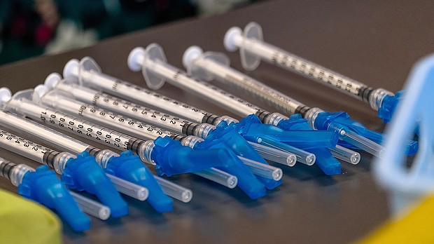 A fourth Covid-19 shot might be recommended this fall, as officials 'continually' look at emerging data. Pictures are Covid-19 vaccine syringes at a vaccination clinic in Peabody, Massachusetts, on January 26.
Mandatory Credit:	Bloomberg via Getty Images