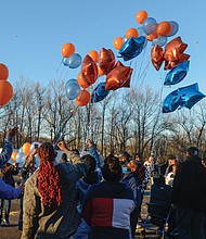 Family and friends of DaShawn “Da Da” Cox release balloons in memory of the 17-year-old Armstrong High School student who was shot and killed about 4:40 p.m. Feb. 17 outside the Ashley Oaks Apartments in the 1400 block of Jennie Scher Road in the East End. The teen’s mother and sister, as well as city officials, spoke at the vigil held last Sunday outside the apartment complex. 
“This is pain that I hope nobody out here will ever have to go through,” his mother, Berthenia Brown, told the crowd through tears. “It hurts.” 
Richmond Schools Superintendent Jason Kamras said he has been to so many vigils for slain young people that he has lost count. “I’m a little ashamed to say that, but it’s the truth.” He and others called for an end to gun violence in the city. 
“Enough is enough,” said 7th District School Board member Cheryl L. Burke, a retired principal. “You all tell us what to do.” 
A community meeting is scheduled for 6 p.m. Thursday, Feb. 24, at the Powhatan Community Center, 5051 Northampton St., to discuss possible solutions. Police are asking anyone with information about DeShawn’s death to call Richmond Police Major Crimes Detective A. Darnell at (804) 646-3927 or to contact Crime Stoppers at (804) 780-1000.