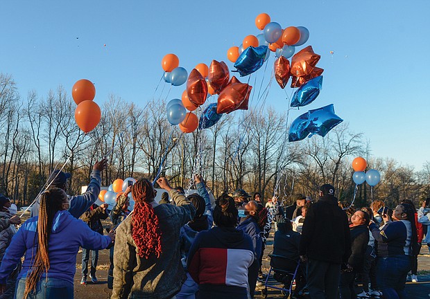Family and friends of DaShawn “Da Da” Cox release balloons in memory of the 17-year-old Armstrong High School student who was shot and killed about 4:40 p.m. Feb. 17 outside the Ashley Oaks Apartments in the 1400 block of Jennie Scher Road in the East End. The teen’s mother and sister, as well as city officials, spoke at the vigil held last Sunday outside the apartment complex. 
“This is pain that I hope nobody out here will ever have to go through,” his mother, Berthenia Brown, told the crowd through tears. “It hurts.” 
Richmond Schools Superintendent Jason Kamras said he has been to so many vigils for slain young people that he has lost count. “I’m a little ashamed to say that, but it’s the truth.” He and others called for an end to gun violence in the city. 
“Enough is enough,” said 7th District School Board member Cheryl L. Burke, a retired principal. “You all tell us what to do.” 
A community meeting is scheduled for 6 p.m. Thursday, Feb. 24, at the Powhatan Community Center, 5051 Northampton St., to discuss possible solutions. Police are asking anyone with information about DeShawn’s death to call Richmond Police Major Crimes Detective A. Darnell at (804) 646-3927 or to contact Crime Stoppers at (804) 780-1000.