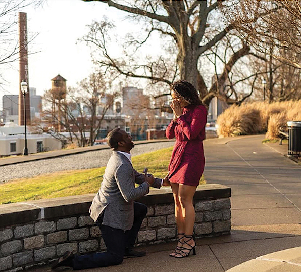 Brandy Washington reacts with surprise and joy to Mayor Levar M. Stoney’s marriage proposal Tuesday at Libby Hill Park. She said “yes.”