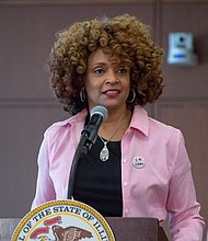Rep. Camille Lilly, D-Chicago, speaks at a news conference in Springfield last year. She's advocating for a bill this General Assembly that would require businesses to pay tipped workers the standard minimum wage. (Capitol News Illinois file photo)