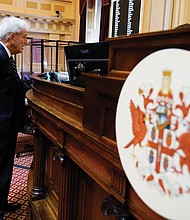 State Sen. Richard Saslaw of Fairfax, chief sponsor of the bill to lure the NFL Washington Commanders to Virginia, speaks to the rostrum staff prior to the start of Tuesday’s Senate session at the Capitol.
