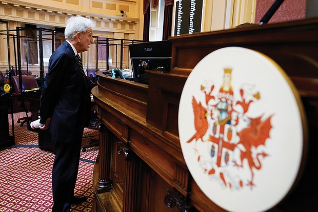 State Sen. Richard Saslaw of Fairfax, chief sponsor of the bill to lure the NFL Washington Commanders to Virginia, speaks to the rostrum staff prior to the start of Tuesday’s Senate session at the Capitol.