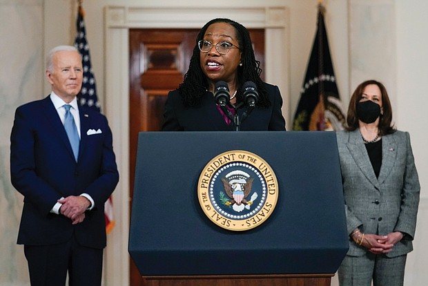Judge Ketanji Brown Jackson speaks Friday in Cross Hall of the White House after President Biden introduced her as his nominee to the U.S. Supreme Court. Listening at right is Vice President Kamala Harris.