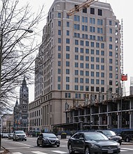 Traffic on Broad Street flows past the new 15- story General Assembly Building at 9th Street in Downtown. More than $191 million is being invested in the building that was in planning since 2016, with development work starting in 2018. State officials are hoping Gilbane Construction can wrap up the work by this fall so members of the Virginia General As- sembly can be in their new offices ahead of the 2023 legislative session. Their offices were moved during the construction to the Pocahontas Building at 900 E. Main St. The new General Assembly Building replaces the former offices, which was comprised of four connected buildings with the tallest at 11 stories. The site once was home to the Richmond office of the Freedman’s Bureau after the Civil War and the Richmond Freedman’s Bank that largely served Black people. The site later was home to the Life Insurance Co. of Virginia before the state purchased it several decades ago.