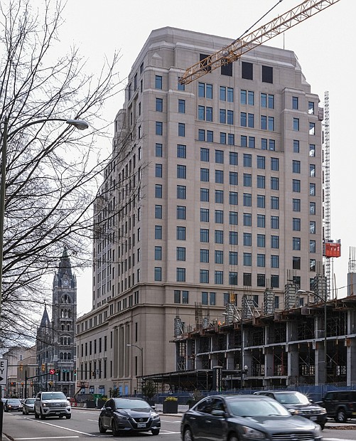 Traffic on Broad Street flows past the new 15- story General Assembly Building at 9th Street in Downtown. More than $191 million is being invested in the building that was in planning since 2016, with development work starting in 2018. State officials are hoping Gilbane Construction can wrap up the work by this fall so members of the Virginia General As- sembly can be in their new offices ahead of the 2023 legislative session. Their offices were moved during the construction to the Pocahontas Building at 900 E. Main St. The new General Assembly Building replaces the former offices, which was comprised of four connected buildings with the tallest at 11 stories. The site once was home to the Richmond office of the Freedman’s Bureau after the Civil War and the Richmond Freedman’s Bank that largely served Black people. The site later was home to the Life Insurance Co. of Virginia before the state purchased it several decades ago.