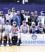 The Fayetteville State University Broncos pose with the CIAA Tournament trophy after clinching the conference title during last Saturday’s finale in Baltimore. It was Fayetteville State’s first CIAA title since 1973.