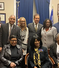 Back row from left to right: Edna W. Cummings (Colonel Ret.) (standing), Chris Goldson, Rodger Murphy Matthews (LTC Colonel Ret.), (son of Vashti Murphy Matthews and 6888 veteran), Natalie Durham (daughter of 6888 veteran Maybelle Campbell), Rep. Brian Higgins (D-NY) and Rep. Gwen Moore (D-WI), Stanley Early (son of 6888 Commander Charity Adams), Elizabeth Helm Frazier are just some of the people who helped the women of 6888th receive official honors. Front Row: Melody Campbell (daughter of Maybelle Campbell), Betty Schuler (daughter of Vashti Muphy Matthews) center front seated; Janice Martin (daughter of 6888 veteran Indiana Hunt-Martin) (Courtesy Photo)