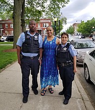 The South Side Jazz Coalition was co-founded by Margaret Murphy-Webb, seen here with police officers during Jazzin on the Steps at St. Moses the Black, located at 331 E. 71st St. PHOTOS PROVIDED BY MARGARET MURPHY-WEBB