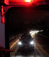 A line of cars and people wait to exit a gate at Joint base Andrews during a lockdown situation in Maryland, US on Sunday, March 6.
Mandatory Credit:	ELIZABETH FRANTZ/REUTERS