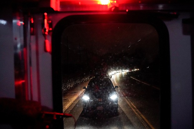 A line of cars and people wait to exit a gate at Joint base Andrews during a lockdown situation in Maryland, US on Sunday, March 6.
Mandatory Credit:	ELIZABETH FRANTZ/REUTERS