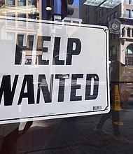 A 'help wanted' sign is posted in front of restaurant on February 4, 2022 in Los Angeles, California. America's worker shortage is far from over: In January, the nation had a record 11.3 million jobs to fill and not enough workers to do so, according to new data from the Bureau of Labor Statistics.
Mandatory Credit:	Frederick J. Brown/AFP/Getty Images