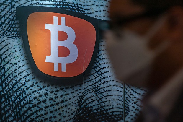 Pedestrians walk past a display of cryptocurrency Bitcoin on February 15, 2022 in Hong Kong, China.
Mandatory Credit:	Anthony Kwan/Getty Images