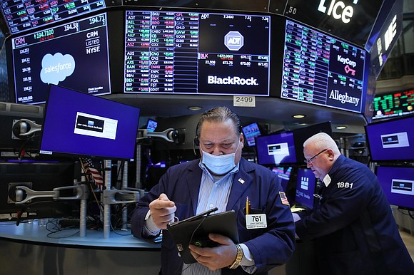 -Stocks surged Wednesday morning as investors celebrated a drop in crude oil prices.