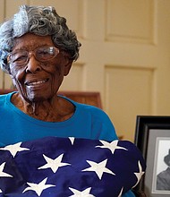 World War II veteran Maj. Fannie Griffin McClendon, a member of the World War II 6888th Central Postal Directory Battalion, poses June 10, 2021, at her home in Tempe, Ariz. The battalion that made history as the only all- female, Black unit to serve in Europe during WWII is set to be honored by Congress with the Congressional Gold Medal.
