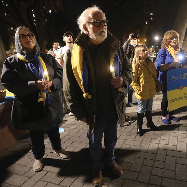 Richmonders pray for peace and the people of Ukraine at a vigil held March 3 at Monroe Park by the Virginia Commonwealth University campus. The vigil was organized by the Rev. Joe Ellison Jr., the chaplain for Virginia Union University’s athletic teams, who spoke during the candlelight event. Various pastors and community members attended the vigil in support, including representatives from the offices of Gov. Glenn A. Youngkin and Mayor Levar M. Stoney.