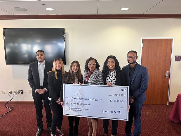Texas Southern University President Lesia Crumpton-Young (center) stands with TSU aviation students (l. to r.) Jacorey Adams, Lubianka Lanza, Katherine Cabrera, Brionne Nixon and Farhan Ahmed. These students received support from a $50,000 per year scholarship that United Airlines has provided to the University, along with mentorship activities with United professionals.