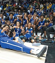 The John Marshall Justices celebrate their fourth state title since 2014. The Justices blew out Radford High School 82-43 last Saturday to claim the state 2A crown.