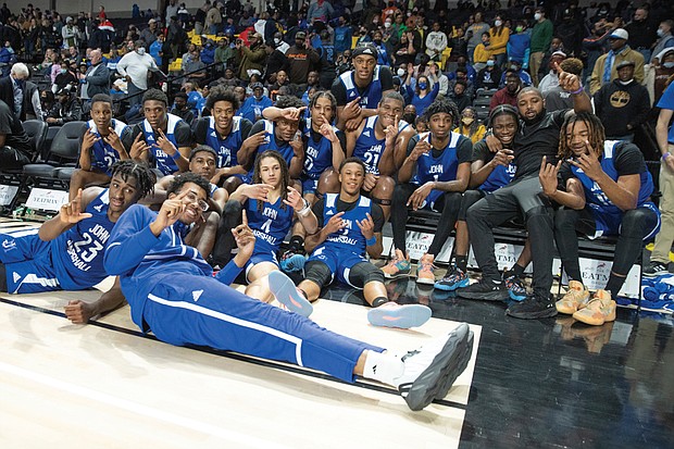 The John Marshall Justices celebrate their fourth state title since 2014. The Justices blew out Radford High School 82-43 last Saturday to claim the state 2A crown.
