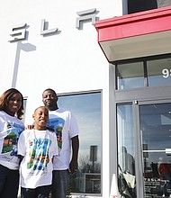 Uziah Smith-Bashir, 8, visits the Tesla dealership on West Broad Street in Glen Allen with his parents, Nafeesa Bashir-James and Torrey James. The second-grader at Thales Academy is enamored with the electric vehicles and the “falcon-wing” doors that open like bird’s wings and has written a book about it that will be launched March 26. Far right, Uziah checks out his favorite Tesla model, Model X, and its “falcon-wing” doors.
