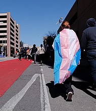Dylan Yeary (L) wears the trans flag during a rally for trans rights in Austin, Texas, in February. A study shows that adding more terms for gender identity and sexual orientation help LGBTQ+ youth feel accepted.
Mandatory Credit:	Aaron E. Martinez/American-State/USA Today Network/Reuters