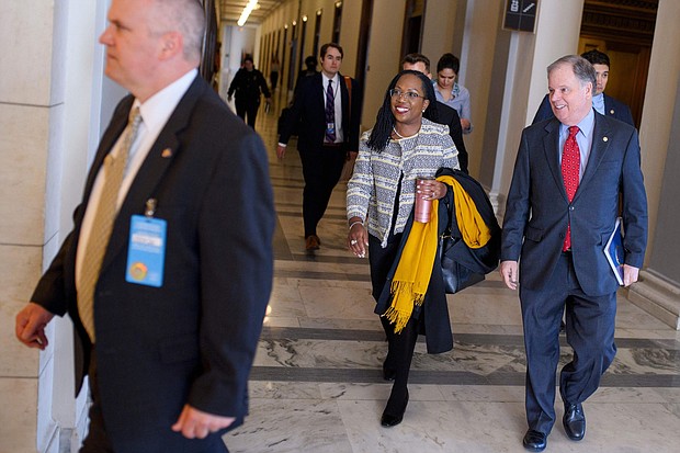Supreme Court nominee Judge Ketanji Brown Jackson, center, and former Senator Doug Jones walk to the office of Senator Marco Rubio (R-FL) for a meeting in the Russell Senate Office Building on Capitol Hill in Washington, DC, on March 15.
Mandatory Credit:	MANDEL NGAN/AFP/Getty Images