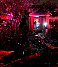 People survey the damage in Arabi, Louisiana, on March 22. A tornado tore through parts of New Orleans on Tuesday night, ripping down power lines and scattering debris in a part of the city that was badly hit by Hurricane Katrina 17 years ago.
Mandatory Credit:	Gerald Herbert/AP