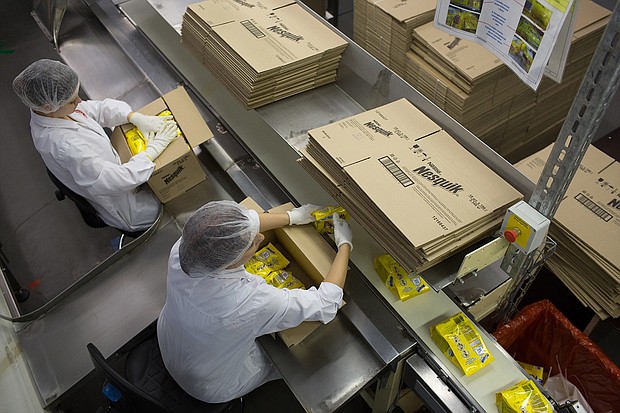 Workers pack boxes with packets of Nesquik in Samara, Russia, in September 2014. Nestlé is halting the sale of Nesquik, among other of its brands, in Russia.
Mandatory Credit:	Andrey Rudakov/Bloomberg/Getty Images