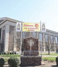 A banner welcomes Fox Elementary School students Monday to their new classrooms at First Baptist Church at Monument Avenue and Arthur Ashe Boulevard, five weeks after a fire displaced them from their school building in The Fan.