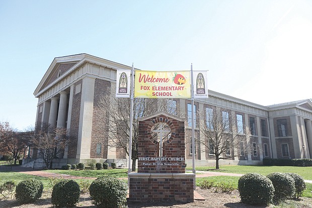 A banner welcomes Fox Elementary School students Monday to their new classrooms at First Baptist Church at Monument Avenue and Arthur Ashe Boulevard, five weeks after a fire displaced them from their school building in The Fan.