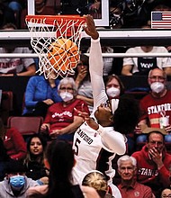 Fran Belibi, a 6-foot-1 junior at Stanford University, throws down the third dunk in NCAA women’s tournament history March 18 during the defending national champion’s game against Montana State University.