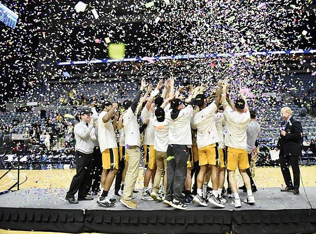 The Randolph-Macon CollegeYellow Jackets celebrate their 75-45 victory over Elmhurst University of Illinois to claim the NCAA Division III Tournament title March 19 in Fort Wayne, Ind.