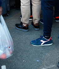 People are seen waiting in line for food at a temporary handout point in Warsaw, Poland on March 18. The economic fallout from Russia's invasion of Ukraine is spilling over to the rest of the world.
Mandatory Credit:	STR/NurPhoto/Getty Images