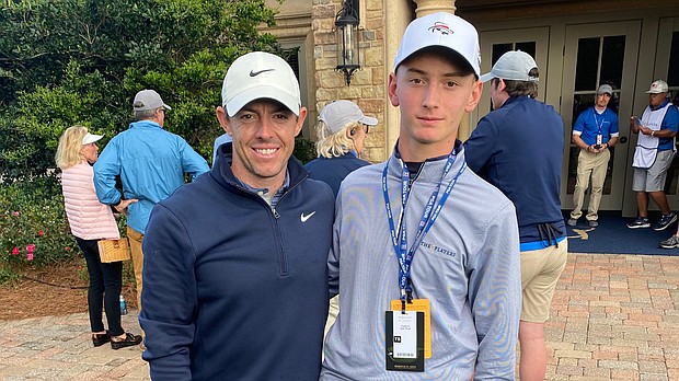 Mykhailo Golod (R) with professional golfer Rory McIlroy during the Players Championship in Ponte Vedra Beach, Florida, on March 14.
Mandatory Credit:	PGA Tour