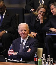 U.S. President Joe Biden looks on as he attends a North Atlantic Council meeting during a NATO summit at NATO Headquarters in Brussels on March 24.
	Evelyn Hockstein/AFP/Getty Images