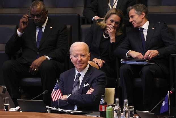 U.S. President Joe Biden looks on as he attends a North Atlantic Council meeting during a NATO summit at NATO Headquarters in Brussels on March 24.
	Evelyn Hockstein/AFP/Getty Images