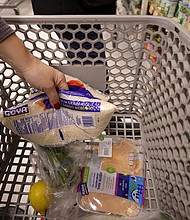 An Instacart shoppers places items in a cart at a ShopRite on January 08, 2022 in Clark, New Jersey.
Mandatory Credit:	Michael Loccisano/Getty Images North America/Getty Images