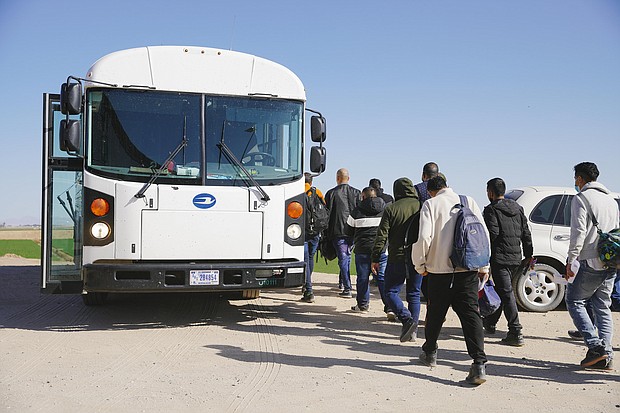 Asylum seekers board a bus to be transported to an immigration facility, after crossing the Mexico/USA border into Yuma on February 21 in Yuma, Arizona.
Mandatory Credit: Katie McTiernan/Anadolu Agency/Getty Images