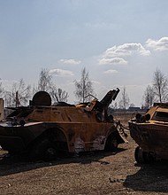 Two destroyed Russian armored personnel carriers are seen on March 25 in Kyiv.
Mandatory Credit:	Alex Chan Tsz Yuk/SOPA Images/LightRocket/Getty Images