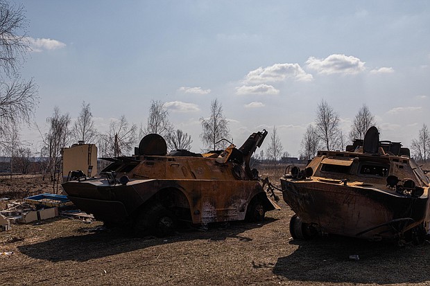 Two destroyed Russian armored personnel carriers are seen on March 25 in Kyiv.
Mandatory Credit:	Alex Chan Tsz Yuk/SOPA Images/LightRocket/Getty Images