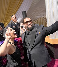 Actor Jason Momoa (R), seen here at the Oscars on March 27, says he and his ex-wife Lisa Bonet are not getting back together.
Mandatory Credit:	John Locher/Invision/AP