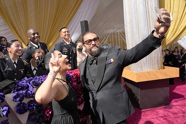 Actor Jason Momoa (R), seen here at the Oscars on March 27, says he and his ex-wife Lisa Bonet are not getting back together.
Mandatory Credit: John Locher/Invision/AP