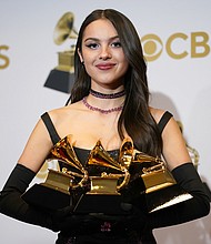 Olivia Rodrigo poses in the press room at the 64th Annual Grammy Awards on Sunday, April 3, in Las Vegas. Rodrigo accidentally broke one of her Grammy Awards.
Mandatory Credit:	John Locher/Invision/AP