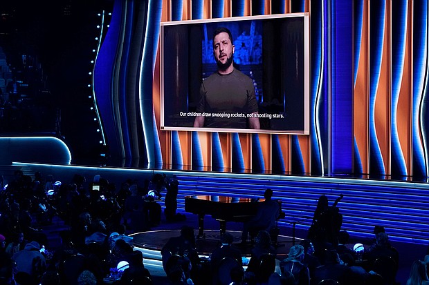 President of Ukraine, Volodymyr Zelensky, speaks on screen at the 64th annual Grammy Awards on Sunday.
Mandatory Credit:	Chris Pizzello/Invision/AP